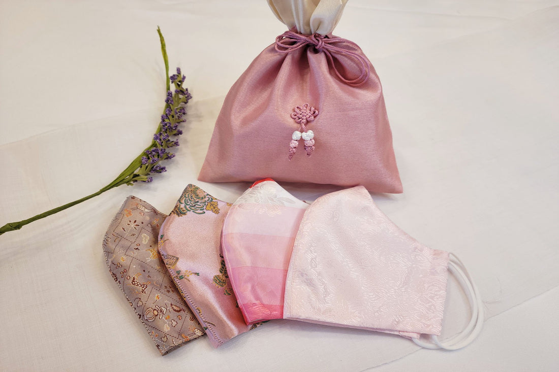 Pink hanbok mask set from Leehwa Wedding and House of Leehwa with bojagi bag